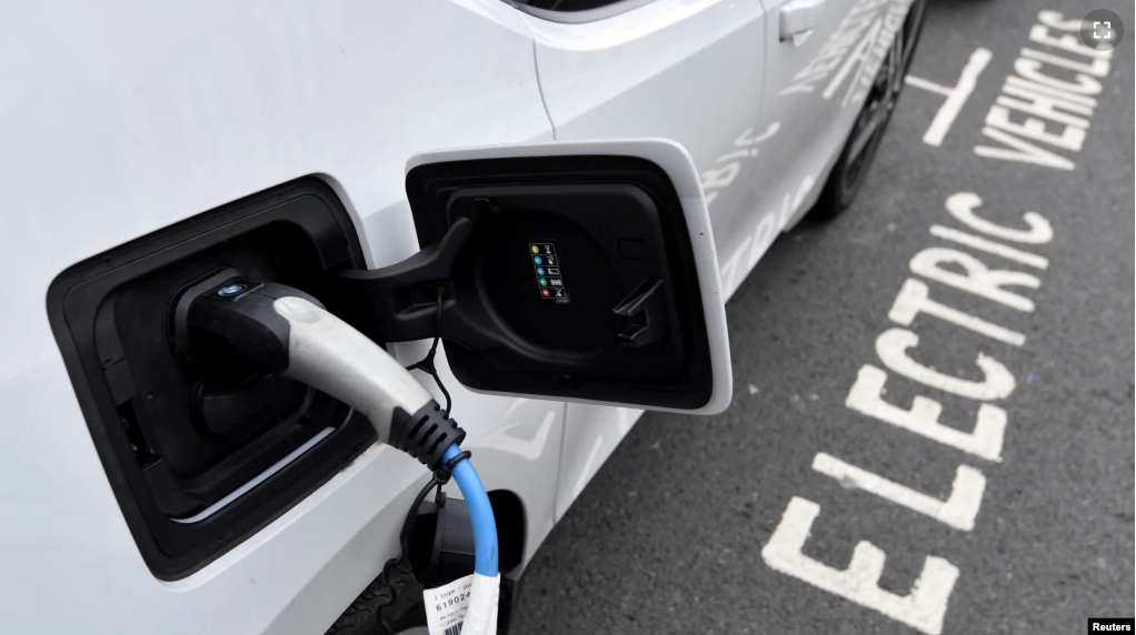 FILE - An electric car is charged at a roadside EV charge point, London, October 19, 2021. (REUTERS/Toby Melville/File Photo)