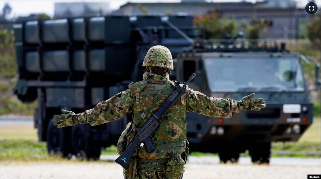 FILE - A member of the Japan Ground Self-Defense Force (JGSDF) conducts a military drill with an anti-ship missiles unit, at JGSDF Miyako camp on Miyako Island, Okinawa prefecture, Japan, Apr. 21, 2022.