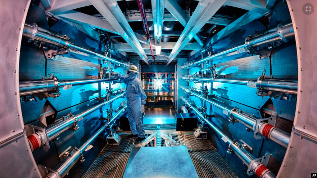 FILE - A technician reviews an optic inside a structure at the Lawrence Livermore National Laboratory in Livermore, Calif. U.S. scientists announced “major scientific breakthrough” on nuclear fusion on Dec. 13, 2022. (Damien Jemison/Lawrence Livermore National Laboratory via AP)