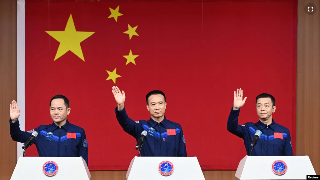 Astronauts Fei Junlong, Deng Qingming and Zhang Lu attend a news conference before the Shenzhou-15 spaceflight mission to build China's space station, at Jiuquan Satellite Launch Center, near Jiuquan, Gansu province, China November 28, 2022. (cnsphoto via REUTERS )