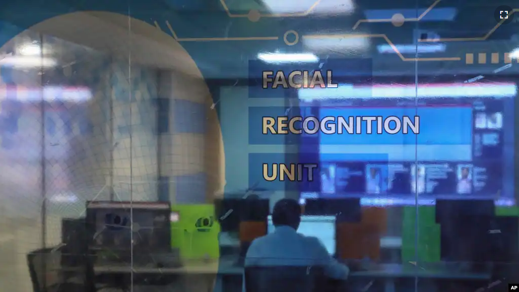 Employees work at the Facial Recognition Unit at the Hyderabad Police Headquarters in Hyderabad, India. (AP Photo/Mahesh Kumar A.)