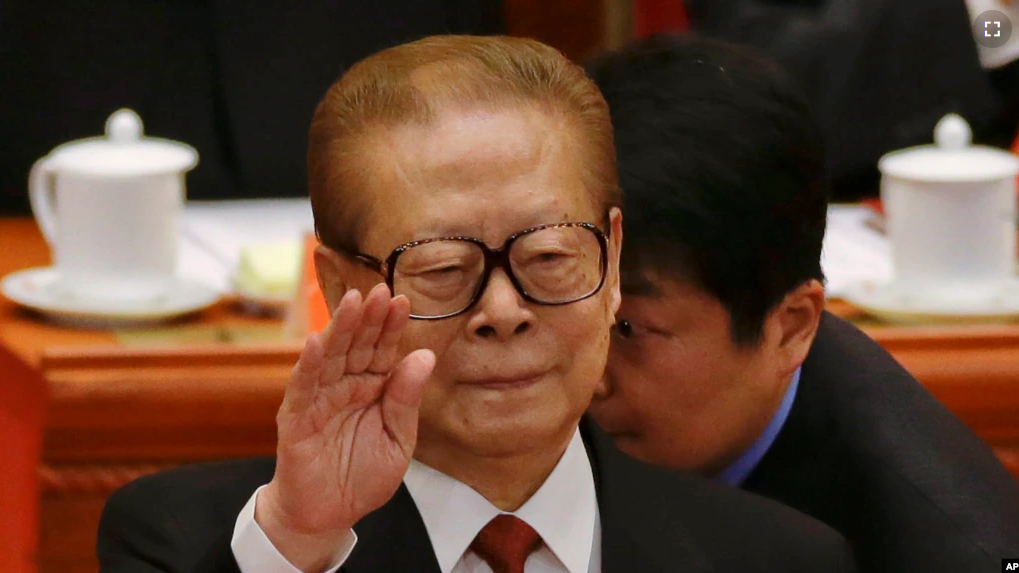 FILE - Former Chinese President Jiang Zemin gestures during the opening session of the 18th Communist Party Congress held at the Great Hall of the People in Beijing, China, Thursday, Nov. 8, 2012. (AP Photo/Ng Han Guan, File)