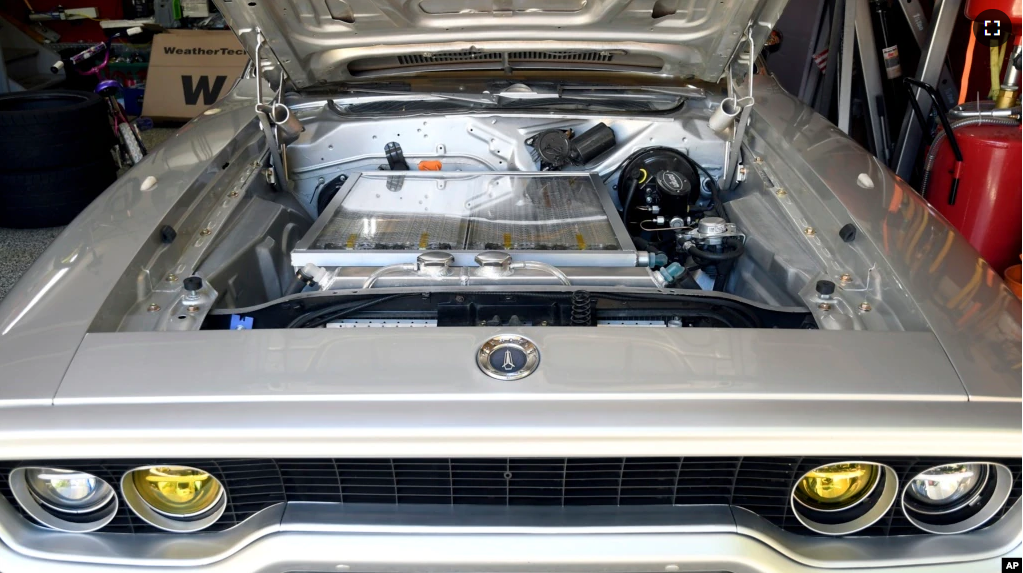 Kevin Erickson's electrified 1972 Plymouth Satellite is seen at his Commerce City, Colo., home on Sept. 20, 2022. Erickson is part of a small but expanding group converting vintage cars and trucks into greener, often much faster, electric vehicles. (AP Photo/Thomas Peipert)