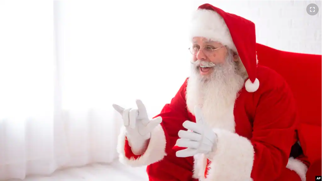 This photo shows Charles Graves dressed as Santa Claus in Austin, Texas on on September 3, 2022. Graves is a rare Deaf Santa in his first year donning the red suit as a professional. (Michael J. Samaripa via AP)