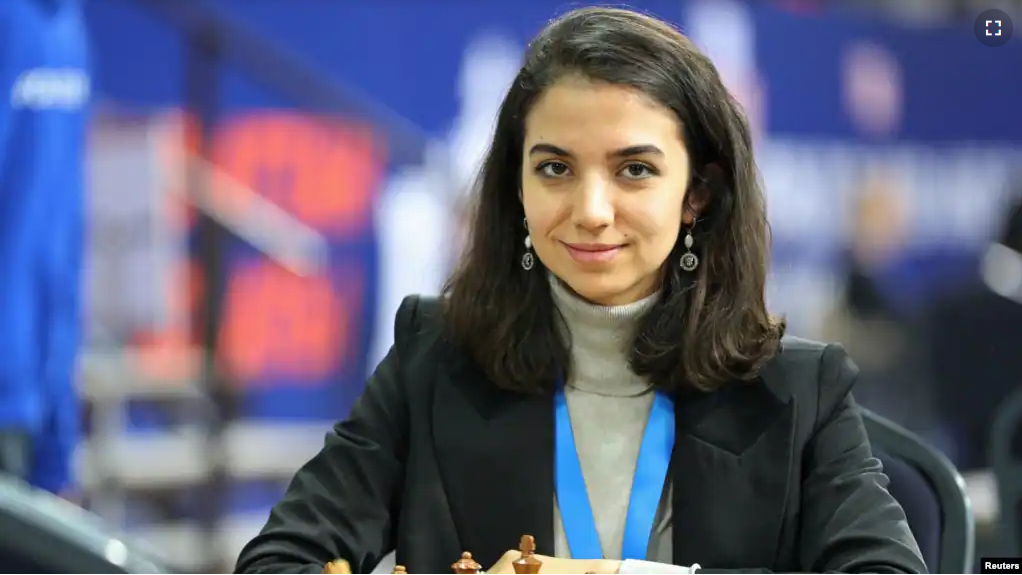 Sara Khadem of Iran sits in front of a chess board at the FIDE World Rapid and Blitz Championships in Almaty, Kazakhstanon on December 28, 2022 . (REUTERS/Pavel Mikheyev)