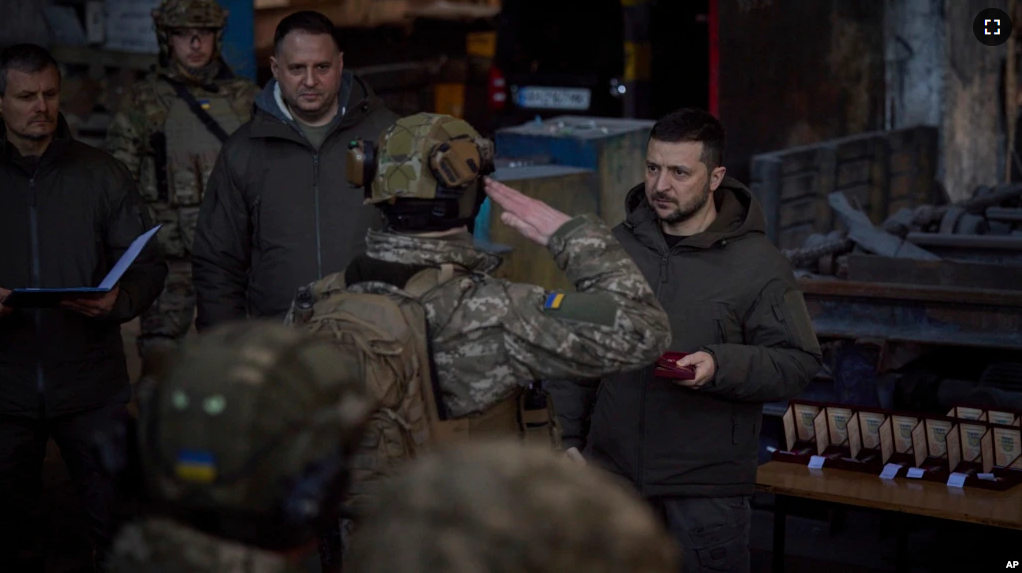 FILE - In this photo provided by the Ukrainian Presidential Press Office, Ukrainian President Volodymyr Zelenskyy, right, awards a serviceman at the site of the heaviest battles with the Russian invaders in Bakhmut, Ukraine, Tuesday, Dec. 20, 2022.