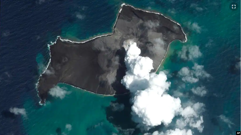 FILE - This satellite image provided by Maxar Technologies shows an overview of Hunga Tonga Hunga Ha'apai volcano in Tonga on Jan. 6, 2022, before a huge undersea volcanic eruption.