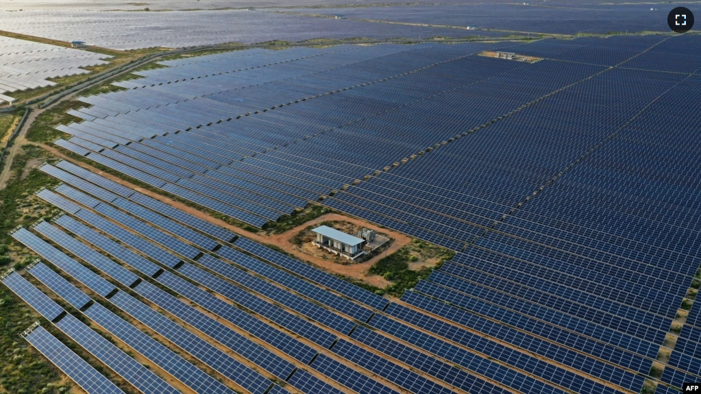 FILE - This photo taken on Oct. 6, 2021 shows solar panels at the site of solar energy projects developer Saurya Urja Company of Rajasthan Limited, in the northern Indian state of Rajasthan. (Photo by Sajjad HUSSAIN / AFP)