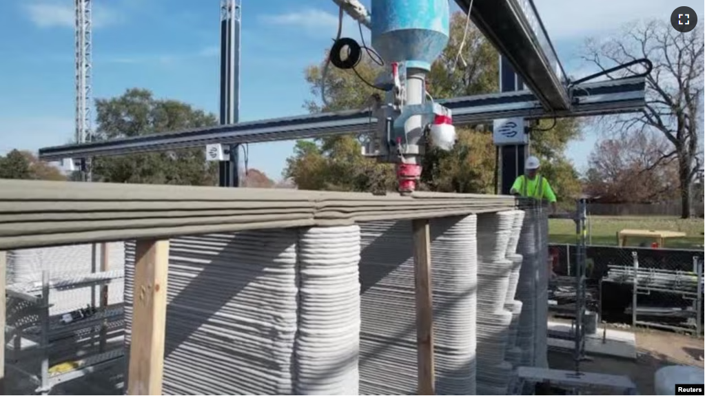 An enormous printer weighing more than 12 tons is creates what is believed to be the first 3D-printed, two-story home in the United States, January 12, 2023. (Reuters from video)