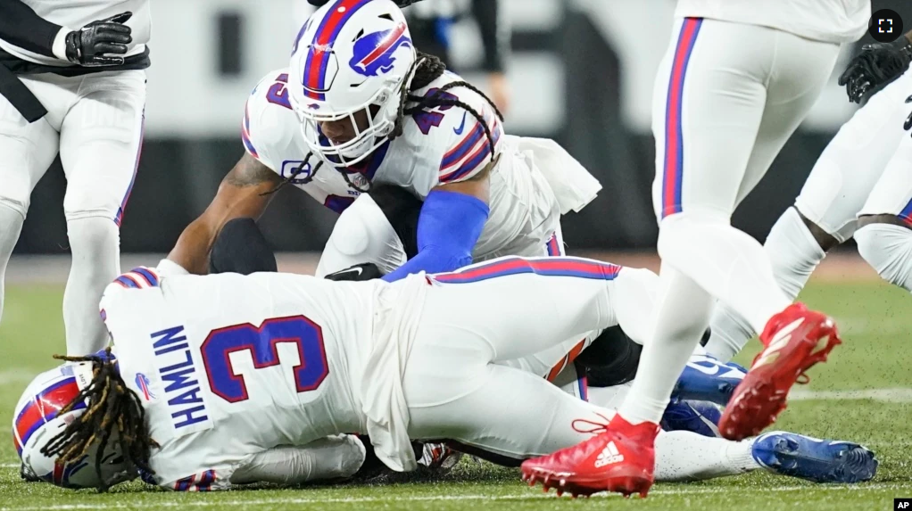 Buffalo Bills football player Damar Hamlin (3) lies on the ground after making a tackle on Cincinnati Bengals player Tee Higgins. After getting up from the play, Hamlin collapsed and was administered CPR on the field. (AP Photo/Joshua A. Bickel)