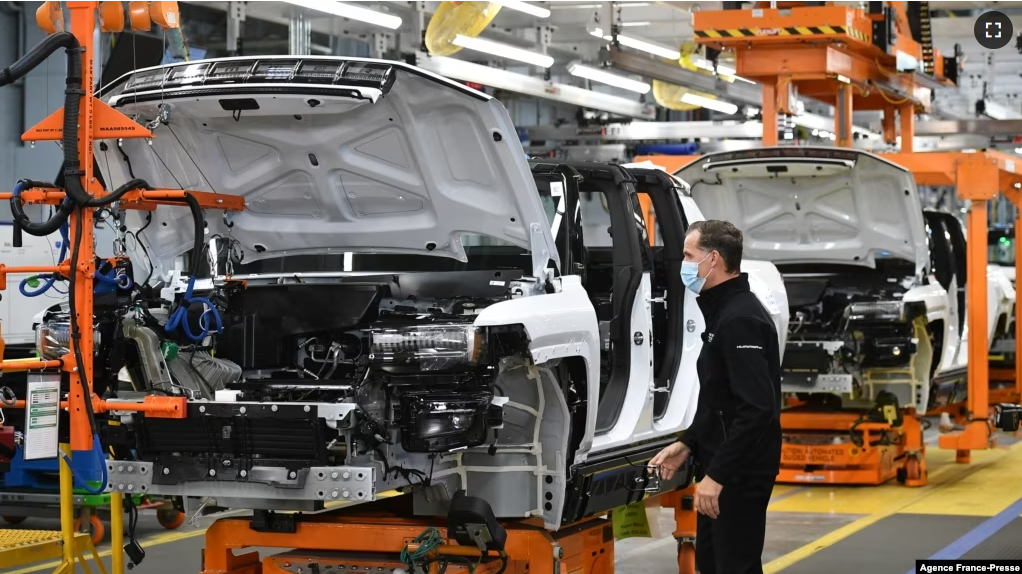 FILE - GMC Hummer EVs are seen on an assembly line at he General Motors Factory ZERO electric vehicle assembly plant in Detroit, Michigan, Nov. 17, 2021. (Photo by MANDEL NGAN / AFP)