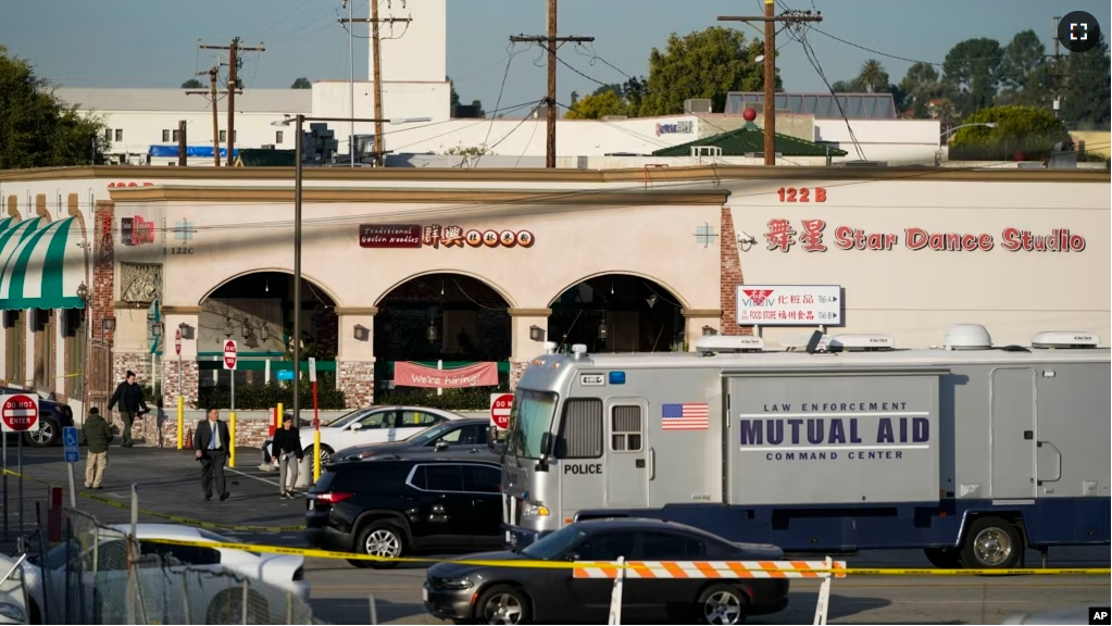 Investigators are seen outside Star Dance Studio in Monterey Park, Calif., Sunday, Jan. 22, 2023. (AP Photo/Jae C. Hong)