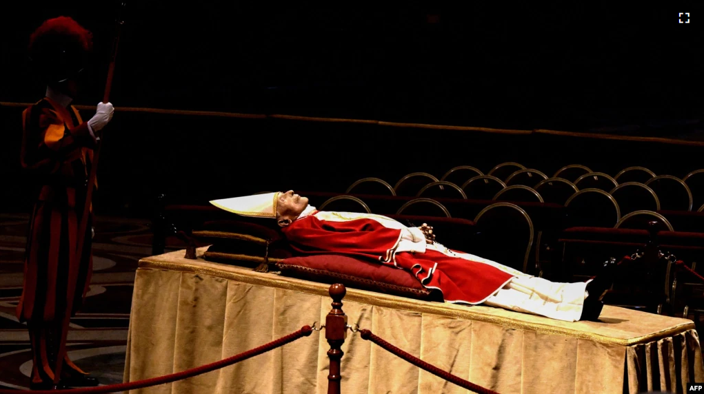 The body of Pope Emeritus Benedict XVI lays in state at St. Peter's Basilica in the Vatican, on January 2, 2023. (Photo by Tiziana FABI / AFP)