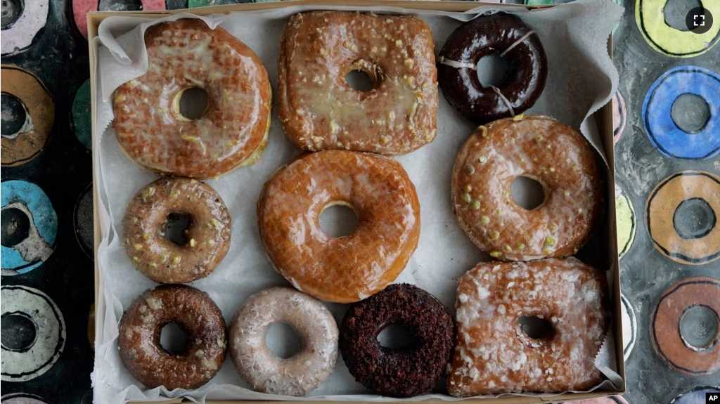 In this Jan. 12, 2007 file photo, a box of transfat-free donuts sit in the front window of the shop on New York's Lower East Side. (AP Photo/Richard Drew, File)