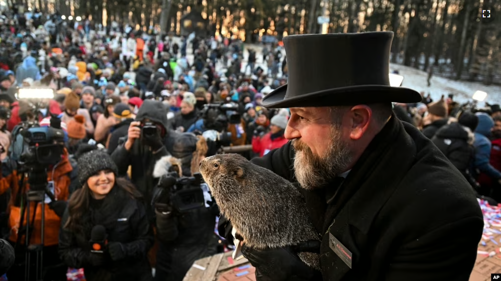 A.J. Dereume holds Punxsutawney Phil during the 137th celebration of Groundhog Day in Punxsutawney, Pa., Feb. 2, 2023. (AP Photo/Barry Reeger)