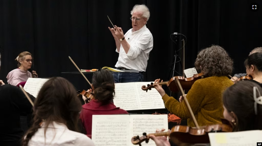 Benjamin Zander conducts the Boston Philharmonic during a rehearsal of Beethoven's Ninth Symphony on Feb. 16, 2023, in Boston. (AP Photo/Michael Dwyer)