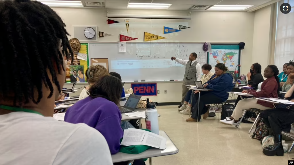 FILE - Emmitt Glynn teaches AP African American studies to a group of Baton Rouge Magnet High School students on Monday, Jan. 30, 2023 in Baton Rouge, La. (AP Photo/Stephen Smith)