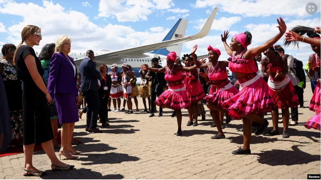 First lady Jill Biden watches a dance performance as she arrives during the first leg of her African visit, at the Hosea Kutako International Airport in Windhoek, in Namibia, Feb. 22, 2023. (REUTERS/Siphiwe Sibeko)