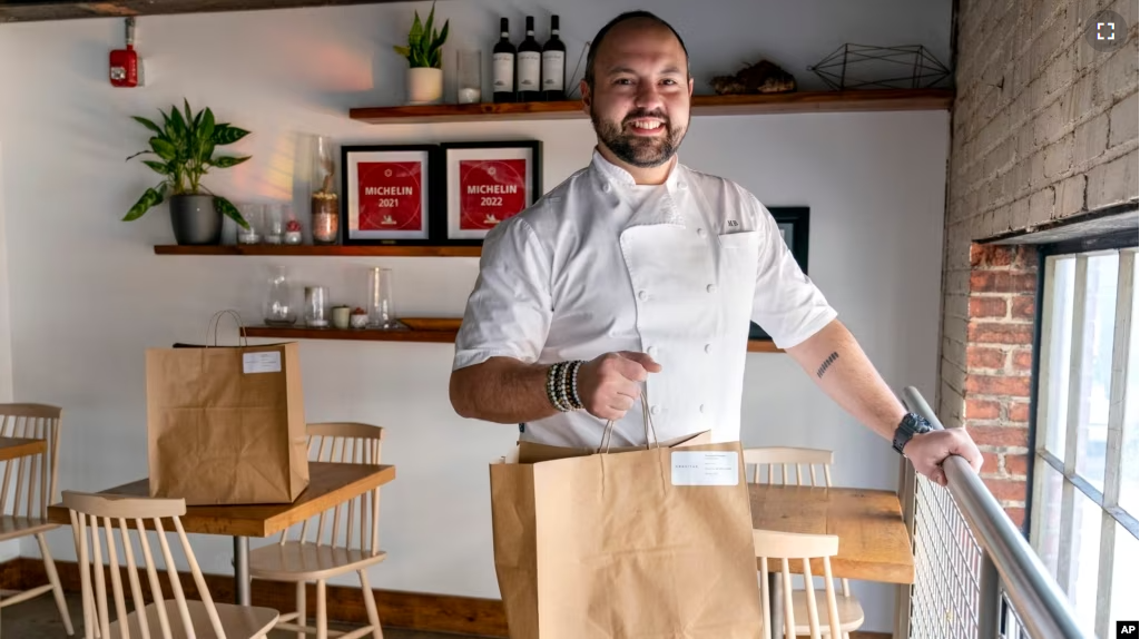 Matt Baker, chef and owner of Gravitas, is at the restaurant on Feb. 14, 2023, in Washington. (AP Photo/Jacquelyn Martin)