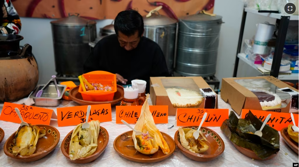 Tamales of different styles are displayed on a table during the tamales fair at the Ixtapalapa neighborhood of Mexico City, Friday, Jan. 27, 2023. (AP Photo/Fernando Llano)