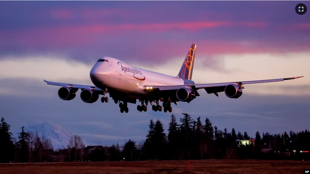 The final Boeing 747 lands at Paine Field following a test flight, Tuesday, Jan. 10, 2023, in Everett, Wash. (Jennifer Buchanan/The Seattle Times via AP)