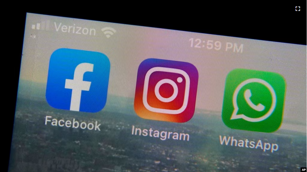 The mobile phone apps for, from left, Facebook, Instagram and WhatsApp are shown on a device in New York. (AP Photo/Richard Drew, File)