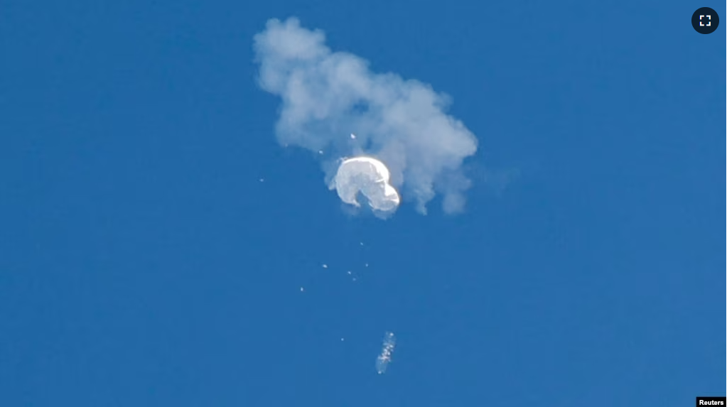 FILE - The suspected Chinese spy balloon drifts to the ocean after being shot down off the coast in Surfside Beach, South Carolina, U.S. February 4, 2023. (REUTERS/Randall Hill/File Photo)