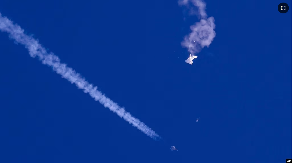 FILE - In this photo provided by Chad Fish, the remnants of a large balloon drift above the Atlantic Ocean, just off the coast of South Carolina, after being shot down by U.S. jet fighter on Feb. 4, 2023. (Chad Fish via AP, File)