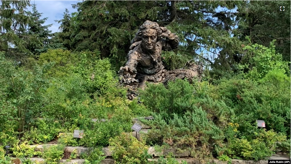 A sculpture of Swedish botanist, zoologist and physician Carl Linnaeus stands in the Heritage Garden of the Chicago Botanic Garden. (AP Photo/Julia Rubin)