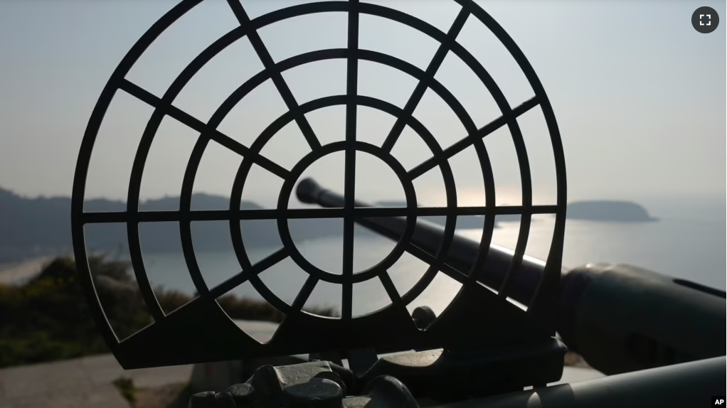 An antiquated 40mm anti-air gun points towards sea at the observation deck on Beigan, part of Matsu Islands, Taiwan on Sunday, March 5, 2023. (AP Photo/Johnson Lai)