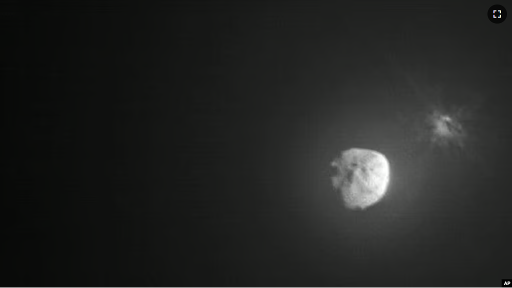 FILE - Debris ejects from the asteroid Dimorphos, right, a few minutes after the intentional collision of NASA’s Double Asteroid Redirection Test mission on Sept. 26, 2022, captured by the nearby Italian Space Agency’s LICIACube. (NASA)