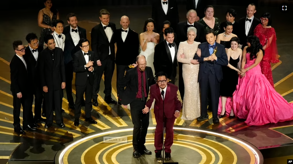 The cast and crew of "Everything Everywhere All at Once" accepts the award for best picture at the Oscars on Sunday, March 12, 2023, at the Dolby Theatre in Los Angeles. (AP Photo/Chris Pizzello)