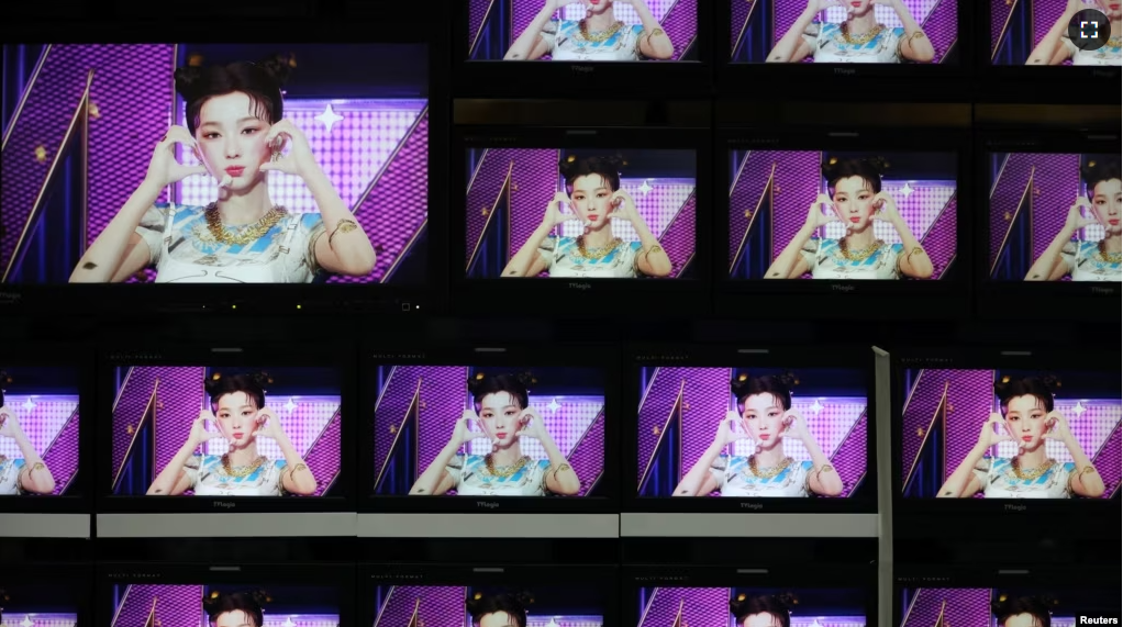 Footages of virtual girl group MAVE is played at the control room of MBC in Seoul, South Korea, February 28, 2023. ( REUTERS/Kim Soo-hyeon)