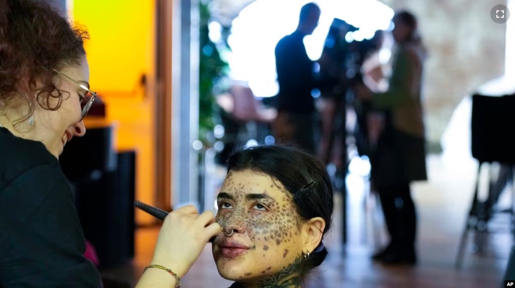 Sparta gets makeup during a photo shoot for the L'Imperfetta model agency in Rome, Tuesday, Feb. 7, 2023.