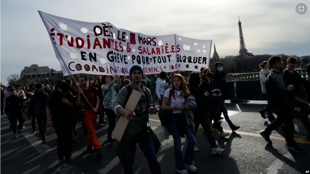 Students shout slogans during a demonstration against the government's plan to raise the retirement age to 64, in Paris Thursday, March 16, 2023.(AP Photo/Lewis Joly