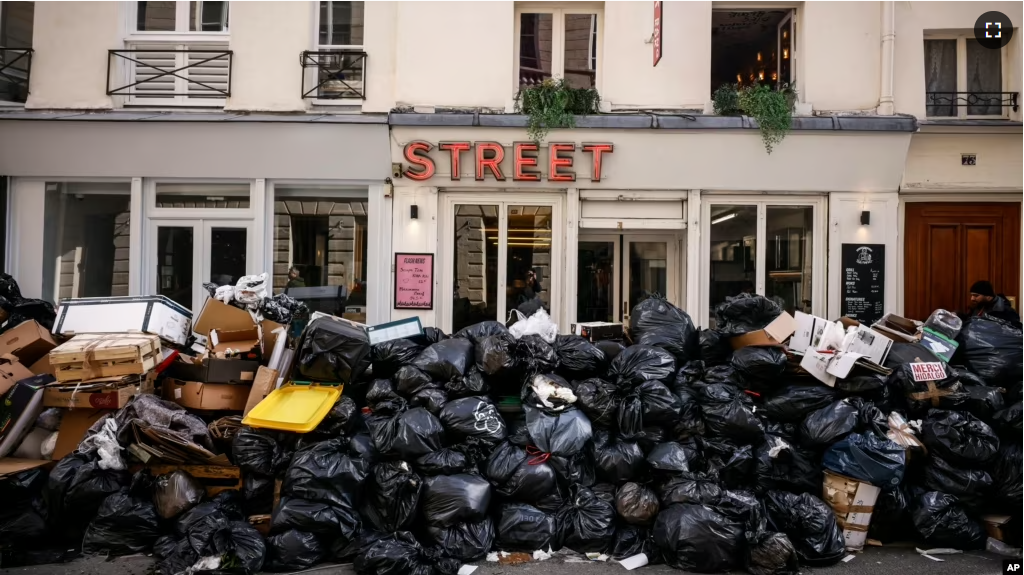 Uncollected garbage is piled up on a street in Paris, March 15, 2023, during an ongoing strike by sanitation workers. (AP Photo/Thomas Padilla, File)