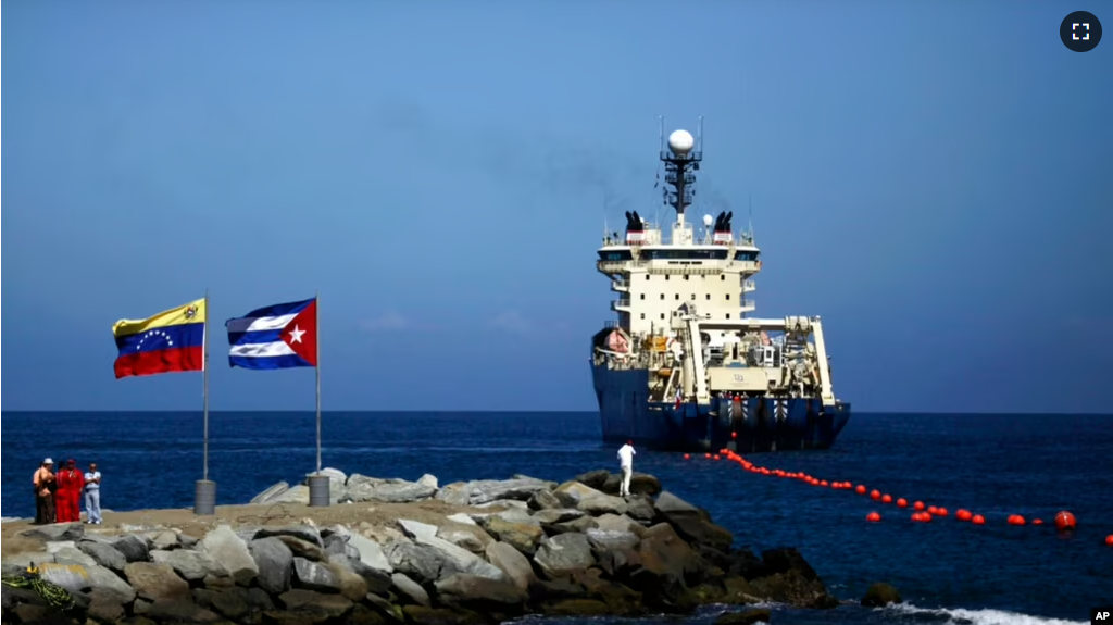 A ship rolls out fiber-optic cable, off La Guaira along the Venezuelan coast, Jan. 22, 2011. Undersea cables carry nearly all intercontinental internet traffic but are subject to many hazards, such as earthquakes and sabotage. (AP Photo/Ariana Cubillos)