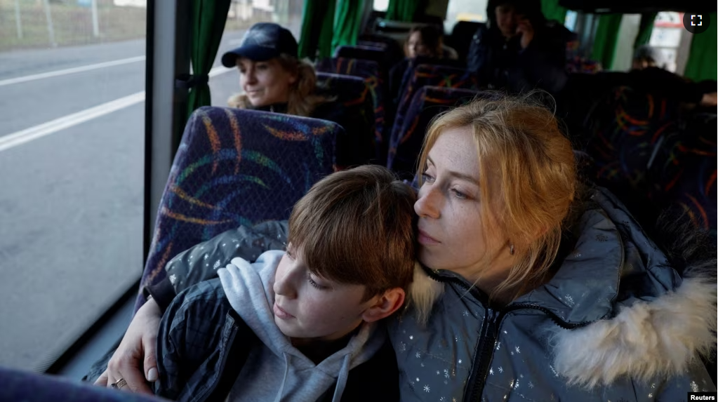 Alla Yatsentiuk embraces her 14-year-old son Danylo, who was taken to Russia, after returning via the Ukraine-Belarus border, in Volyn region Ukraine April 7, 2023. (REUTERS/Valentyn Ogirenko)