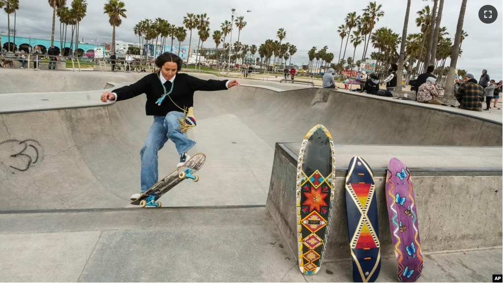 Expert skateboarder Di'Orr Greenwood, an artist born and raised in the Navajo Nation in Arizona and whose work is featured on the new U.S. stamps, exits the concrete bowl in the Venice Beach neighborhood in Los Angeles Monday, March 20, 2023. (AP Photo/Damian Dovarganes)