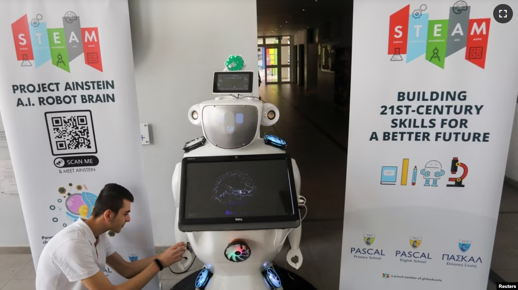 High school student Konstantinos Timinis works on "Alnstein", a robot powered with ChatGPT, in Pascal school in Nicosia, Cyprus on March 30, 2023. (REUTERS/Yiannis Kourtoglou)