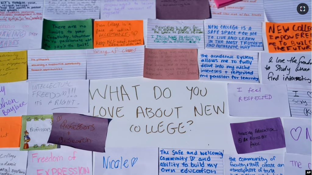 Notes written by students describing what they love about New College of Florida are stuck to a poster during a protest ahead of a meeting of the school's board of trustees, Tuesday, Feb. 28, 2023, in Sarasota, Fla. (AP Photo/Rebecca Blackwell)