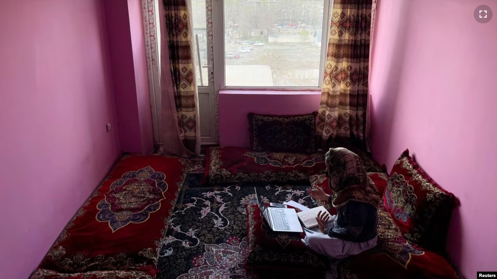 Sofia, an Afghan student, speaks English during an online class, at her house in Kabul, Afghanistan, March 18, 2023. (REUTERS/Sayed Hassib)