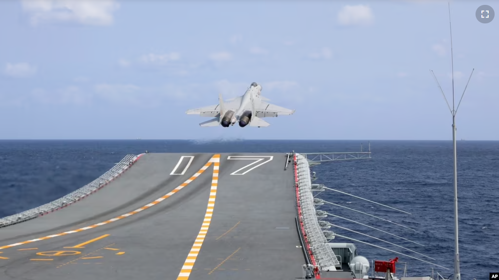 In this Xinhua News Agency photo, a J-15 Chinese fighter jet takes off from the Shandong aircraft carrier during military exercises around the Taiwan. (An Ni/Xinhua via AP)