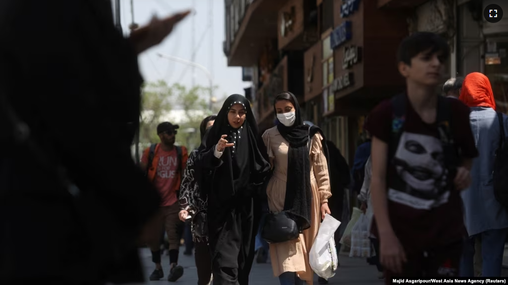 Iranian women walk on a street amid the implementation of the new hijab surveillance in Tehran, Iran, April 15, 2023. Majid Asgaripour/West Asia News Agency via Reuters