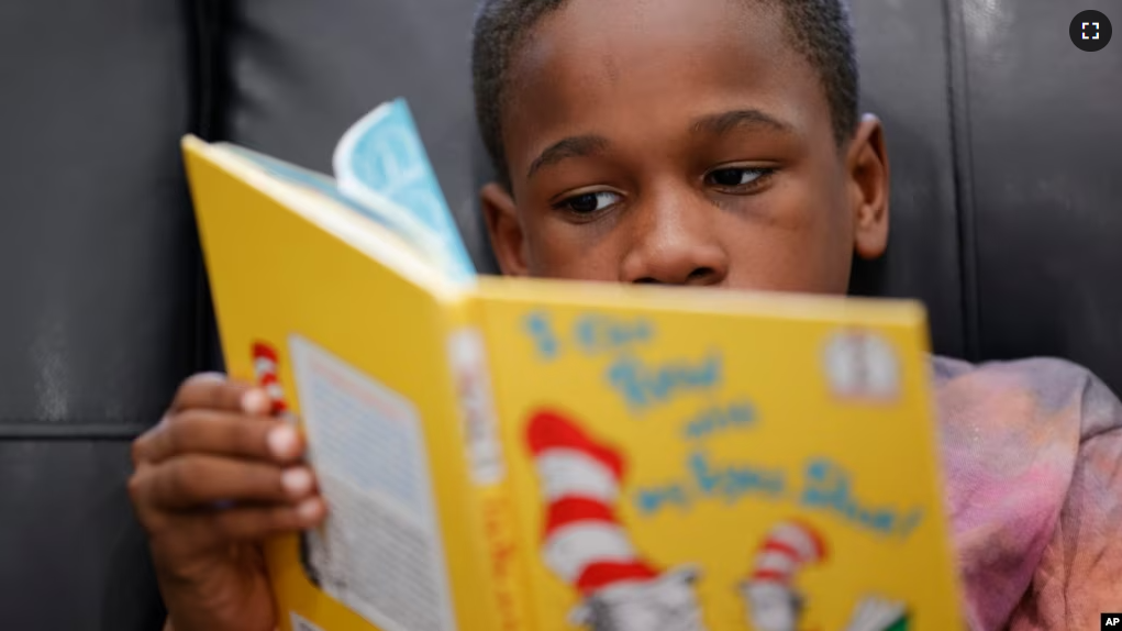 Michael Crowder, 11, reads during an after-school literacy program in Atlanta on Thursday, April 6, 2023. (AP Photo/Alex Slitz)