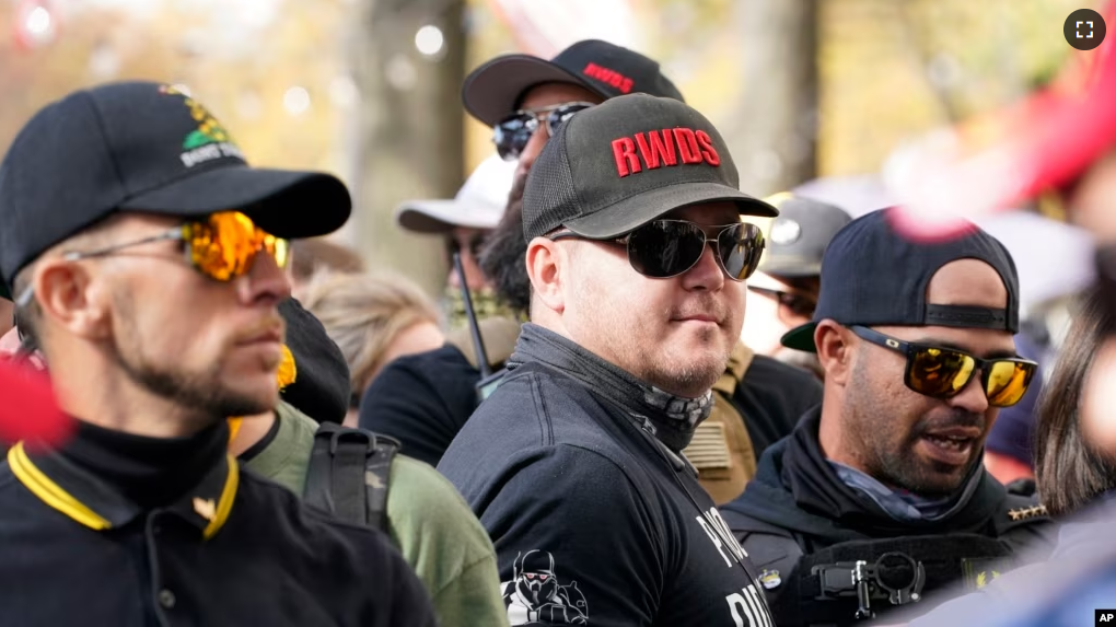 FILE - People identifying themselves as members of the Proud Boys joined a march on Nov. 14, 2020, in Washington. The gunman who killed eight people on Saturday, May 6, 2023, at a Dallas-area mall was also wearing a “RWDS” patch. (AP Photo/Jacquelyn Martin, File)