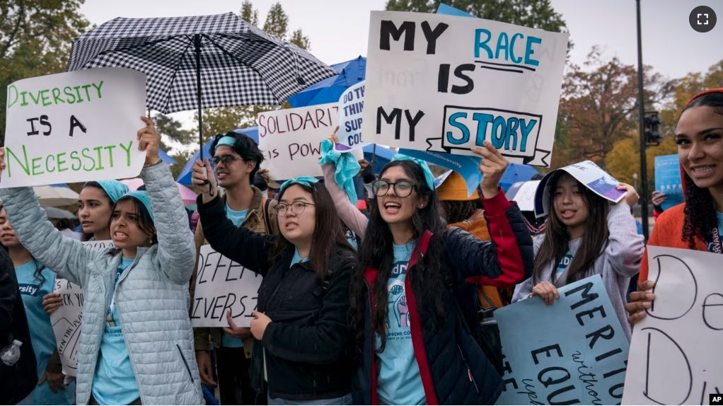 FILE - Students and activists rally outside the Supreme Court as the court before oral arguments in two cases that could decide the future of affirmative action in college admissions, Monday, Oct. 31, 2022, in Washington. (AP Photo/J. Scott Applewhite)