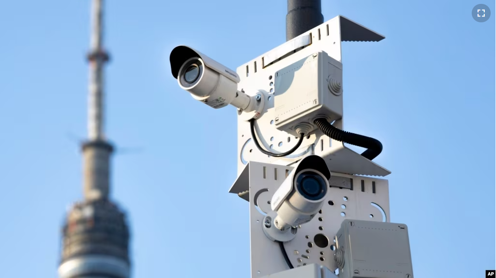 FILE - Surveillance cameras sit on a utility pole in Moscow, Russia on February 22, 2020. (AP Photo, File)