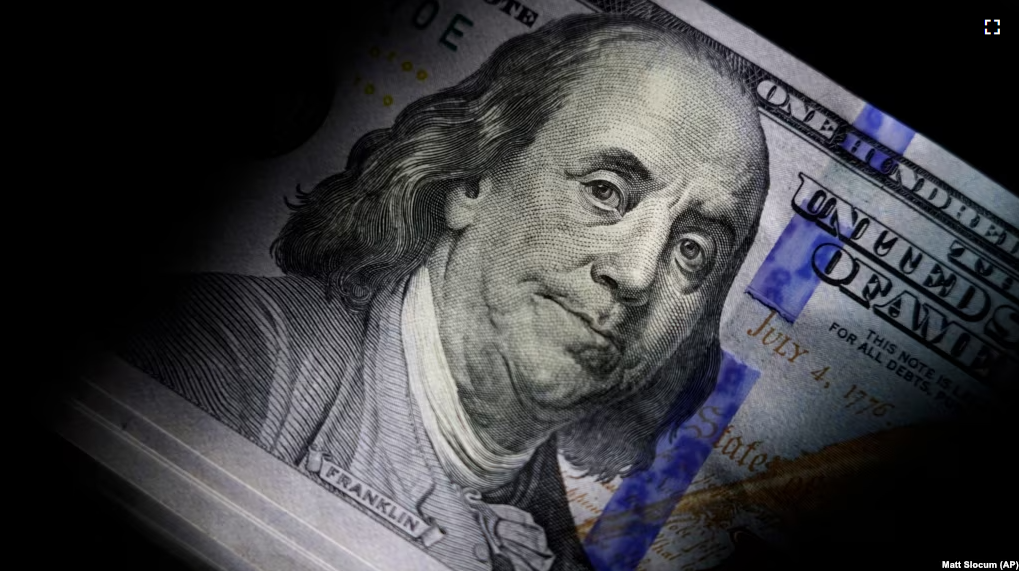 FILE - The likeness of Benjamin Franklin is seen on U.S. $100 bills, Thursday, July 14, 2022, in Marple Township, Pa. (AP Photo/Matt Slocum )