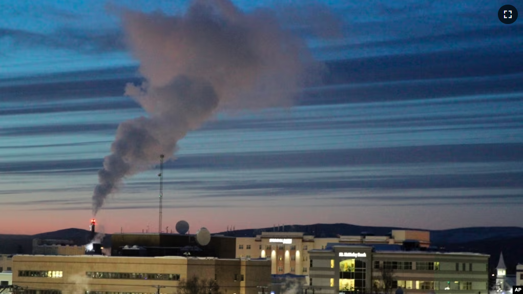 In this file photo, a plume of smoke being emitted into the air is seen from a power plant, Feb. 16, 2022, in Fairbanks, Alaska. (AP Photo/Mark Thiessen, File)